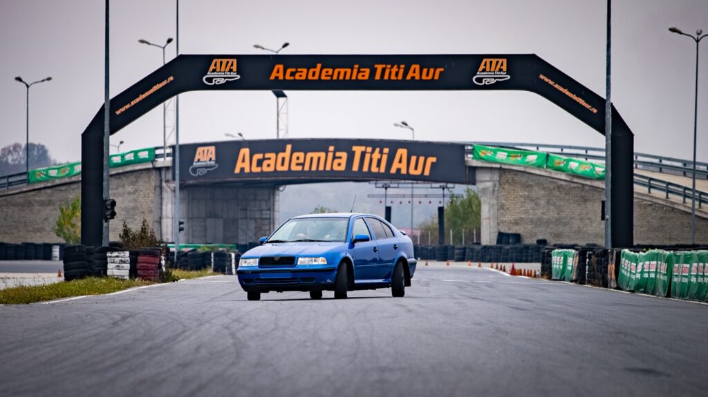 Academia Titi Aur training car at the entrance to the driving academy
