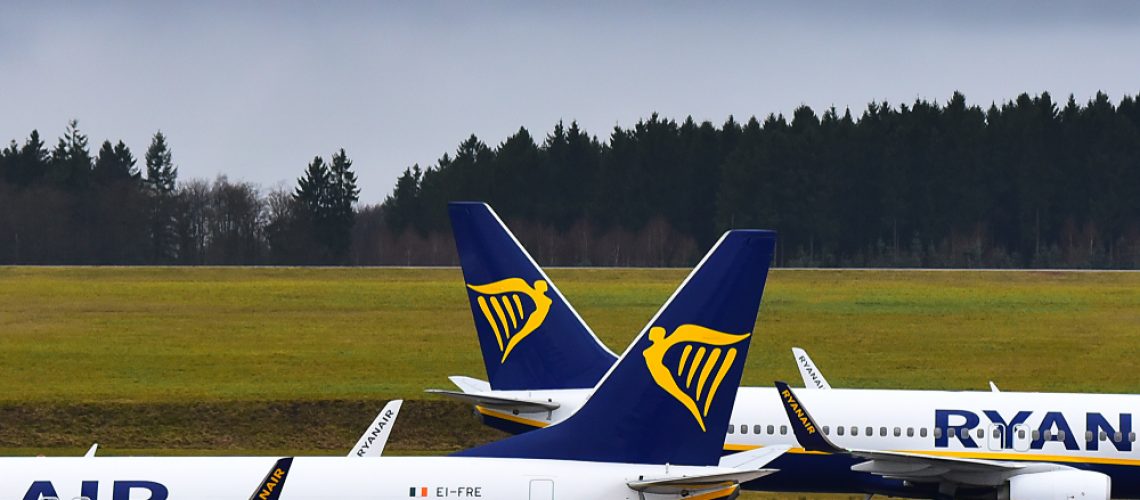 Two Ryanair aircraft parked on the apron at an airport, positioned tail-to-tail with Ryanair logos visible on both aircraft tails.